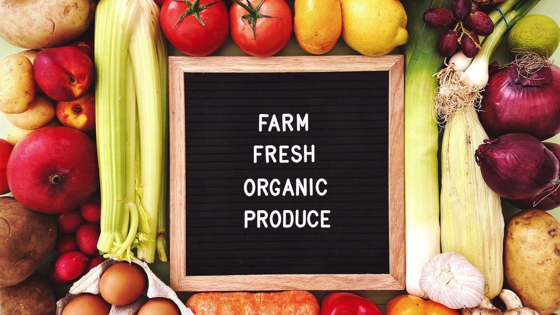 Fresh Vegetables on a Table with a Farm Fresh Organic Produce Sign